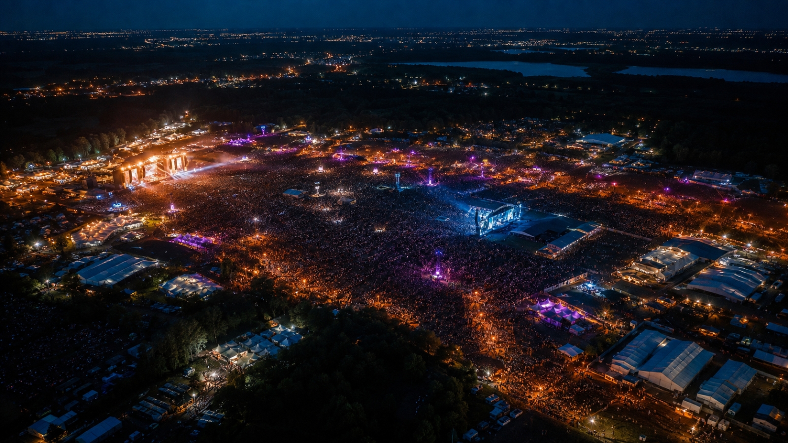 Aerial view of a large festival at night covered by IP ArchiTechs event WiFi